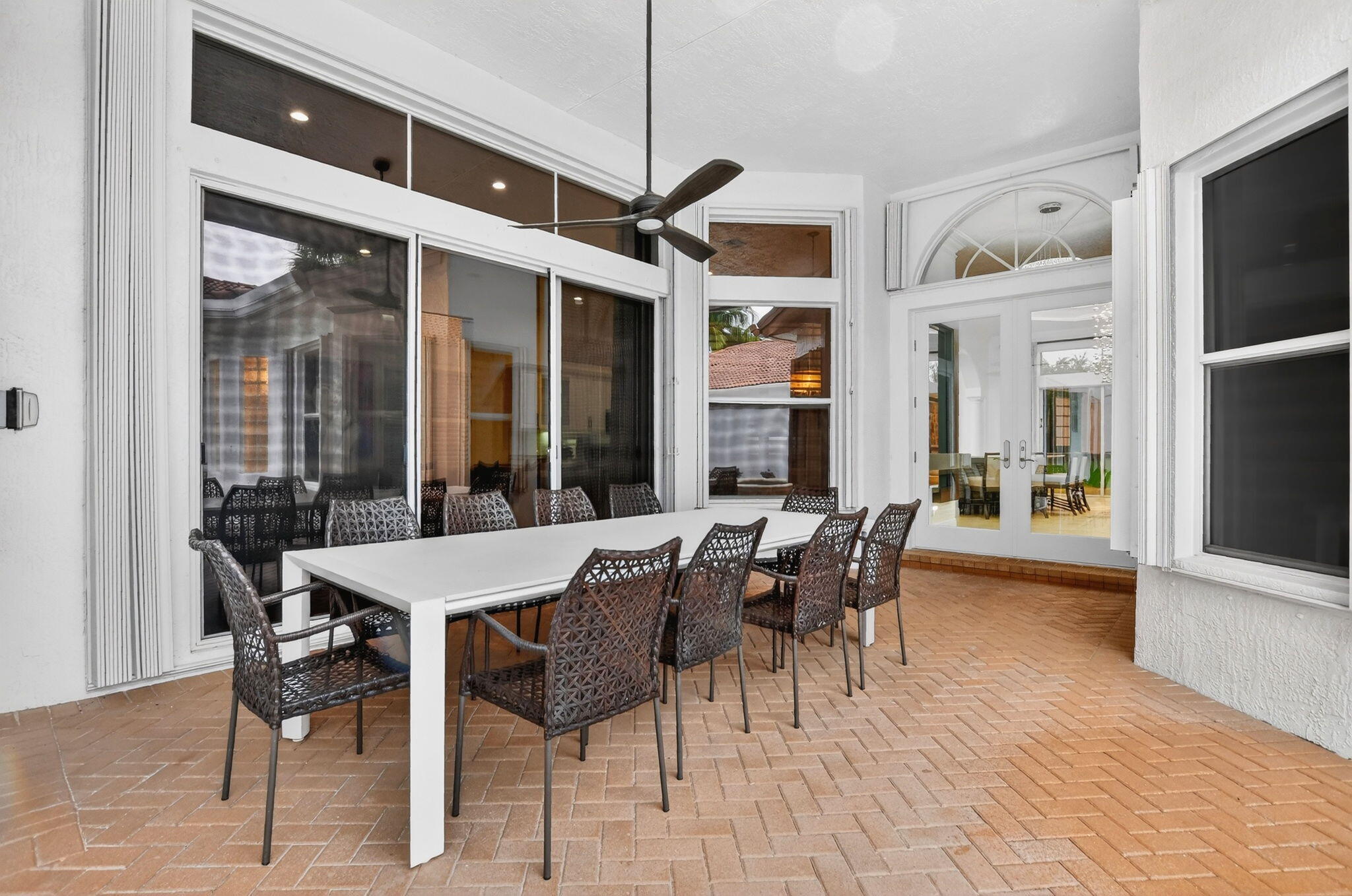 8030 Laurel Ridge Court Delray Beach, FL 33446 - Photo 8 of 87 a view of a dining room with furniture window and wooden floor