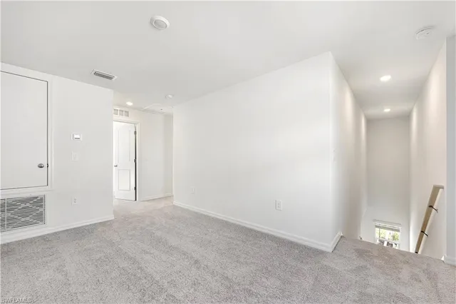 a view of an empty room and window