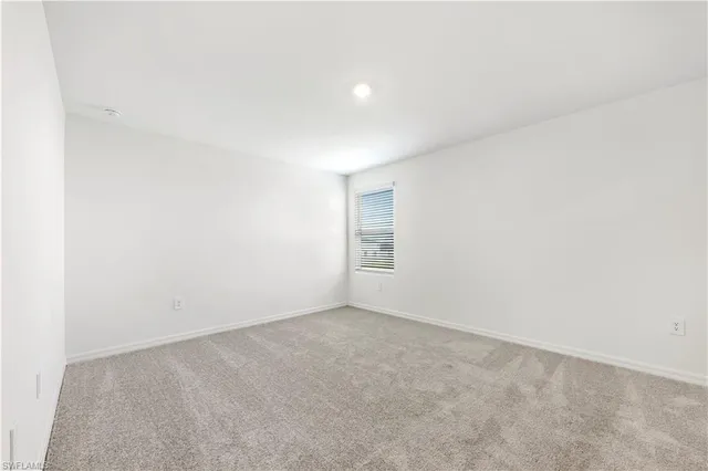 a bathroom with a shower sink and mirror