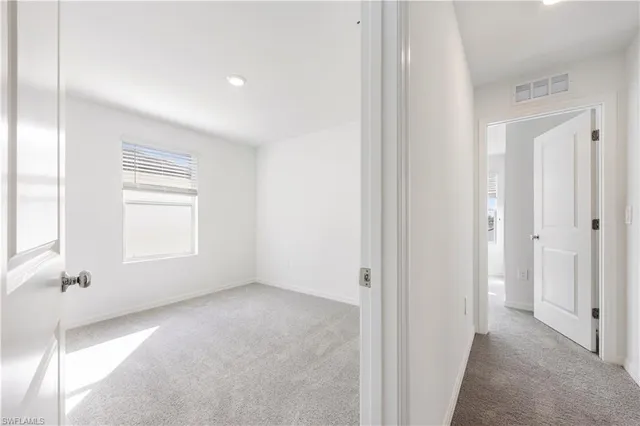a bathroom with a double vanity sink toilet mirror and bathtub