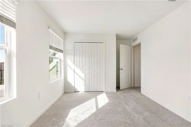 a view of a town with mountains in the background