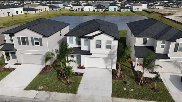 a aerial view of a house with a yard