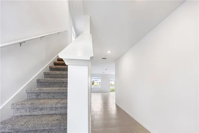 a view of a hallway view with staircase