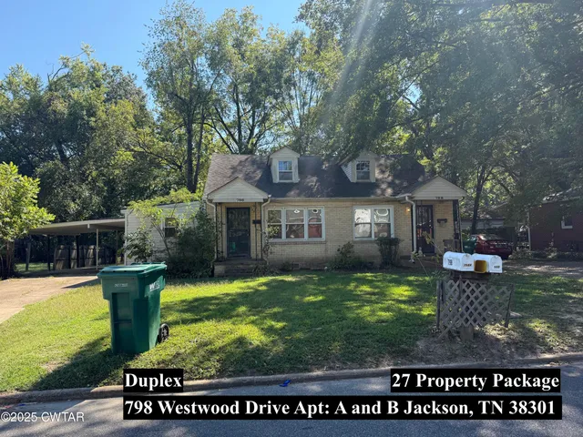 a view of a house with backyard porch and sitting area