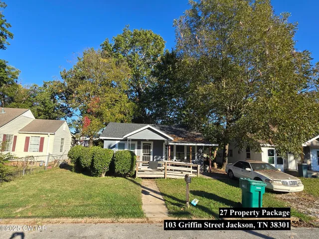 a front view of a house with swimming pool having outdoor seating