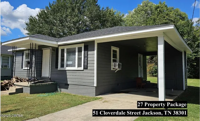 a view of house with backyard outdoor seating and green space