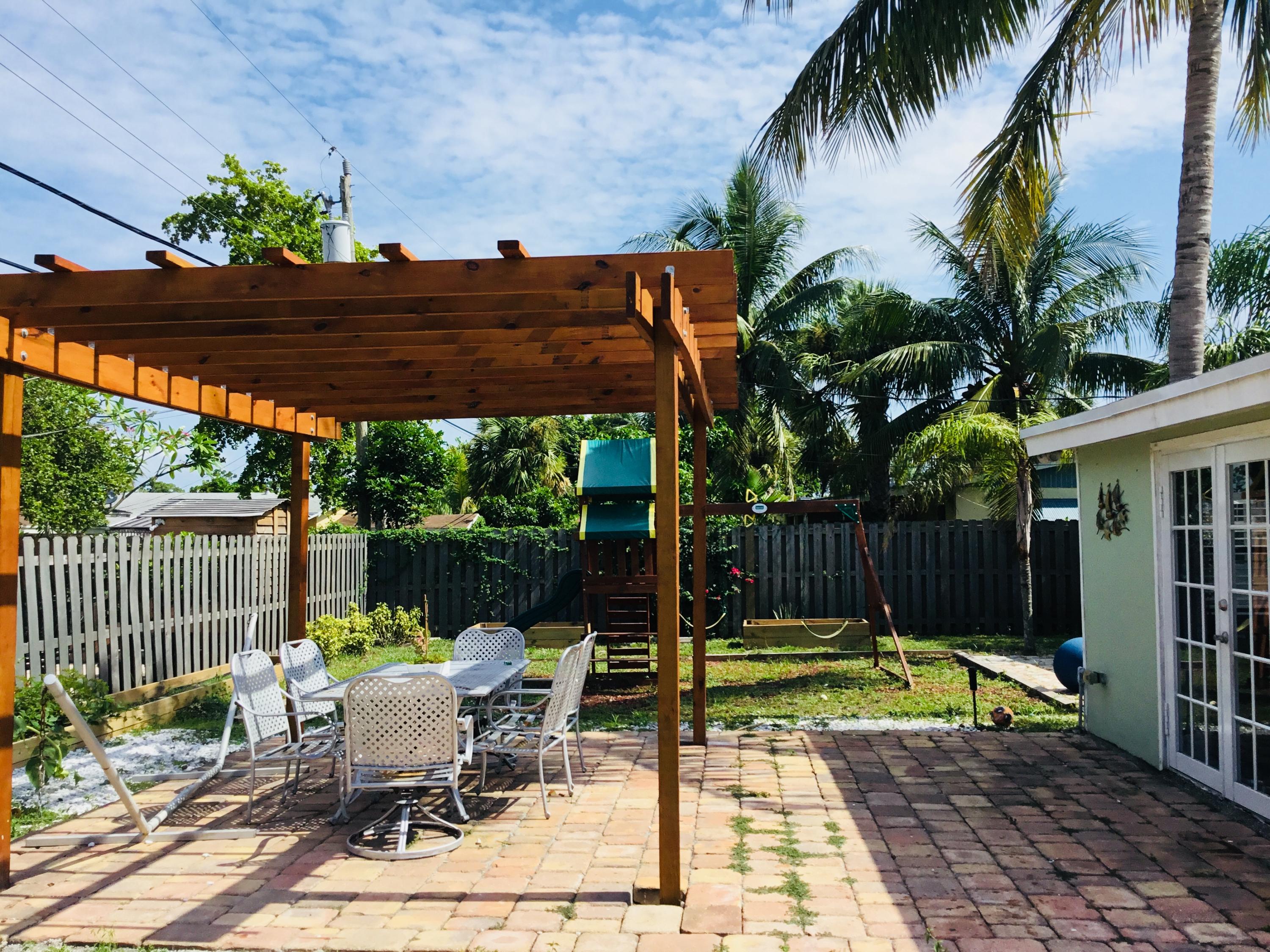 1357 Drexel Road West Palm Beach, FL 33417 - Photo 8 of 17 Back yard/Pergola/Play set