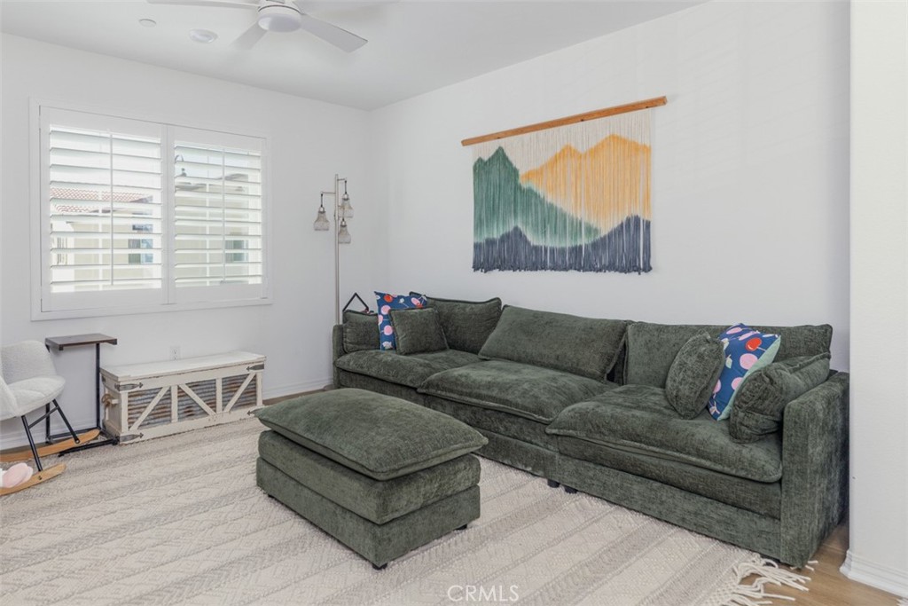 7395 Olive Grv Street Riverside, CA 92507 - Photo 6 of 18 Great room with ceiling fan and plantation shutters.