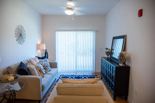 a bedroom with furniture and a window