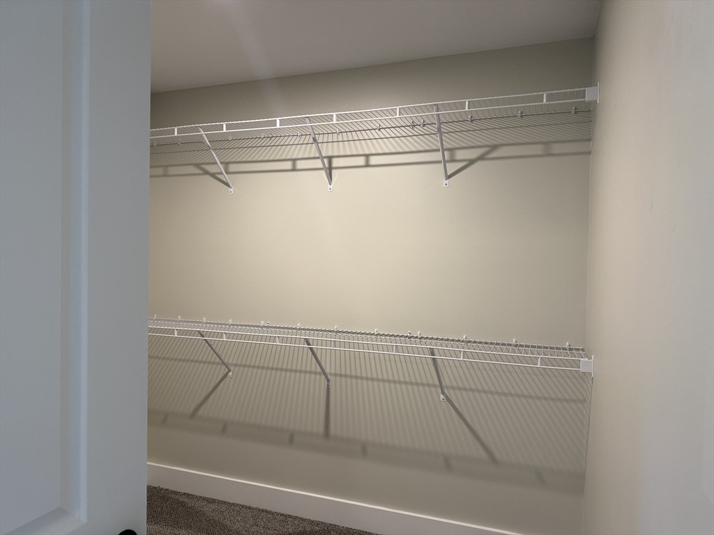 480 Wareham Street, Unit 12 Middleboro, MA 02346 - Photo 17 of 19 a view of a room with racks on the wall