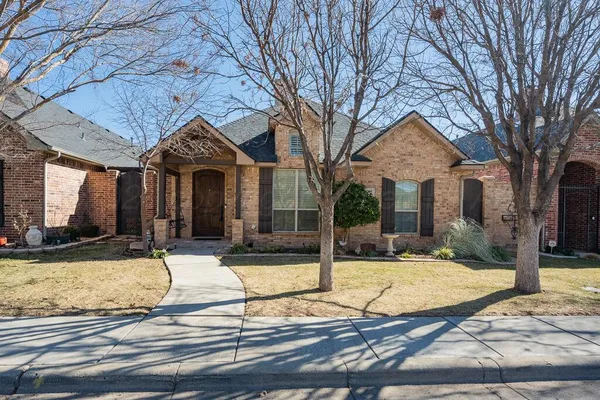 a view of a house with snow on the background