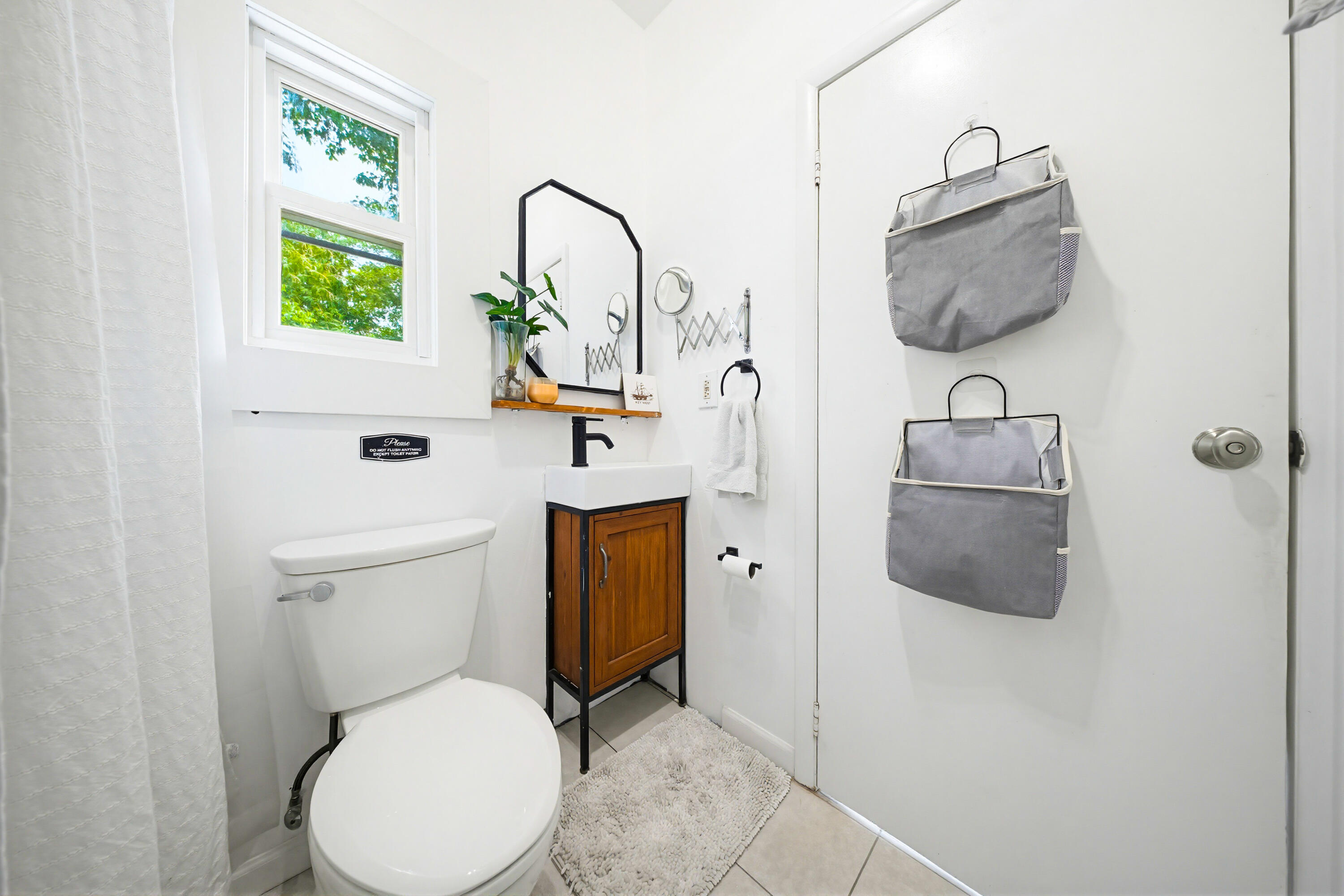 529 Simonton Street Key West, FL 33040 - Photo 48 of 81 a white toilet sitting next to a bathroom sink