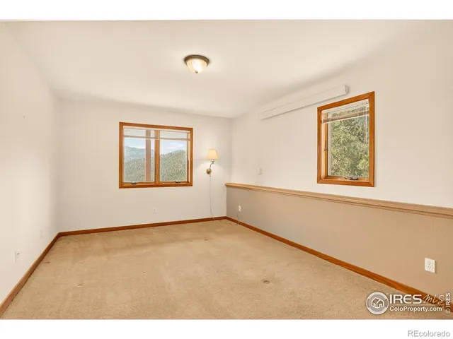 a view of an empty room with windows