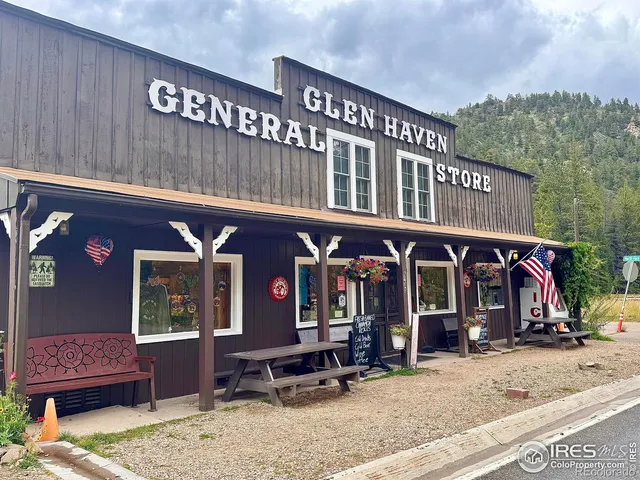 a backyard of a house with barbeque oven and outdoor seating
