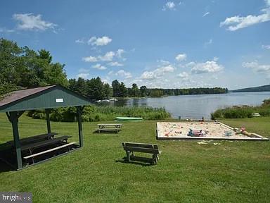 66 Paradise Ridge Road Oakland, MD 21550 - Photo 20 of 24 a view of a lake with a big yard