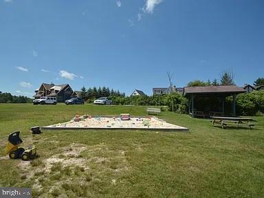 66 Paradise Ridge Road Oakland, MD 21550 - Photo 21 of 24 a view of a swimming pool and lake view