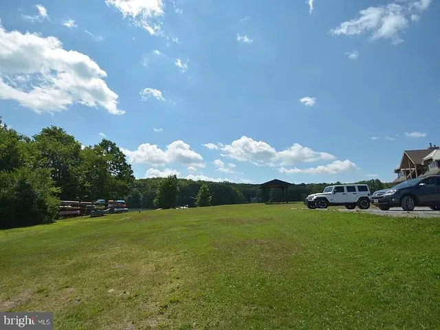 a view of an ocean and a yard