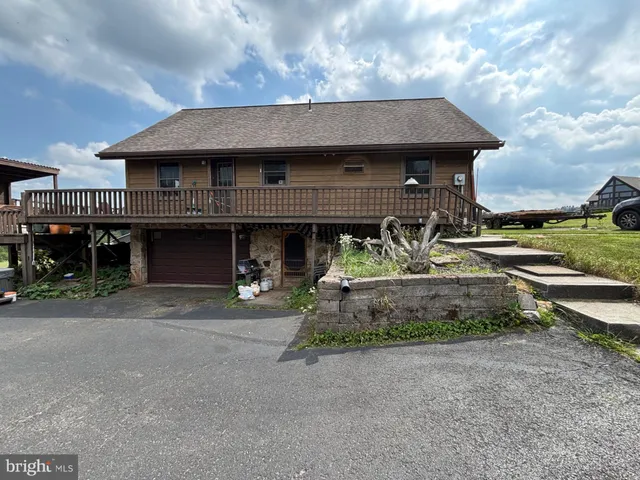 a view of a car park in front of house