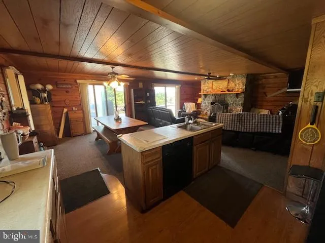 a kitchen with sink cabinets and refrigerator