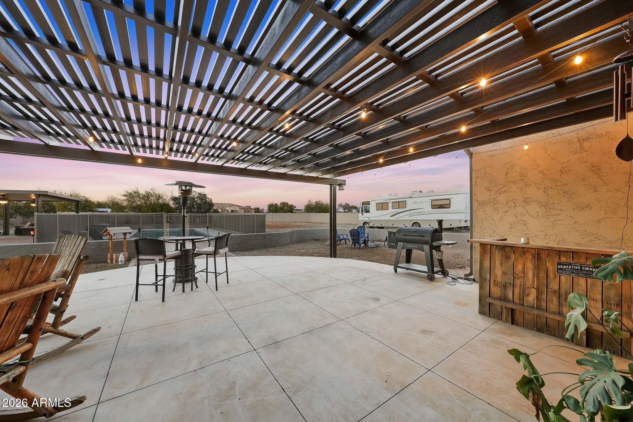 23024 West Sierra Ridge Way Wittmann, AZ 85361 - Photo 81 of 99 a view of a chairs and table in the patio