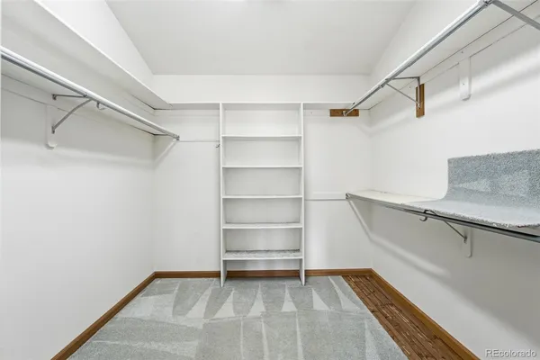 a view of an empty walk in closet