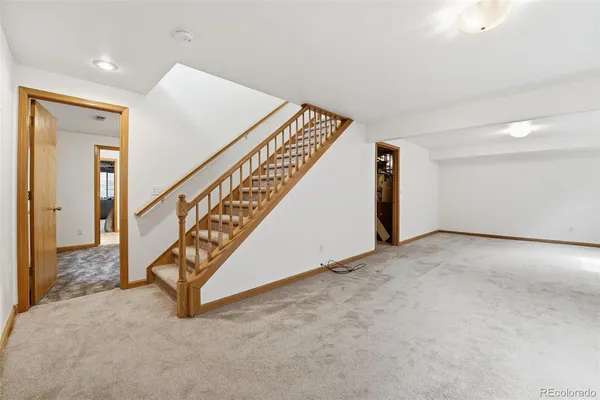 a view of an empty room with stairs