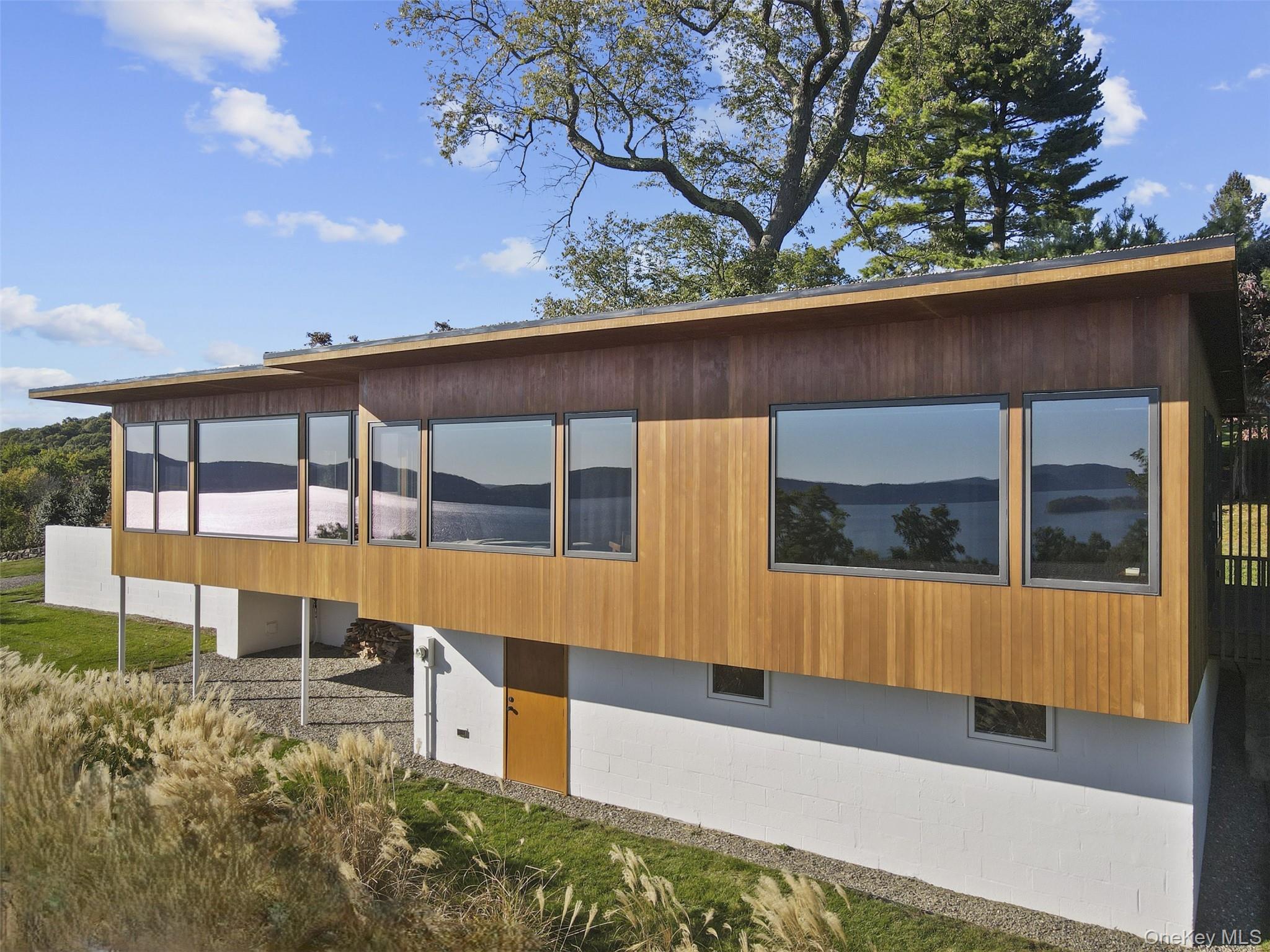 15 Finney Farm Road Croton-on-Hudson, NY 10520 - Photo 18 of 32 Main House with Windows Reflecting the Hudson River View