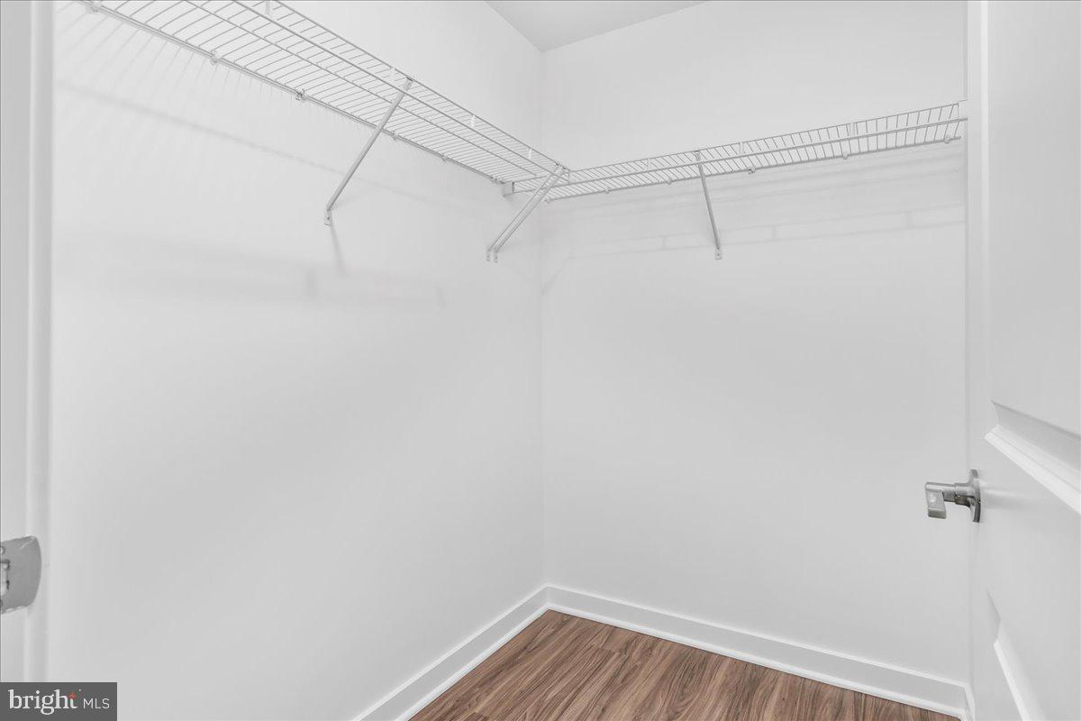 709 Iron Frg Road, Unit A Frederick, MD 21702 - Photo 12 of 15 a view of a room with racks on the wall