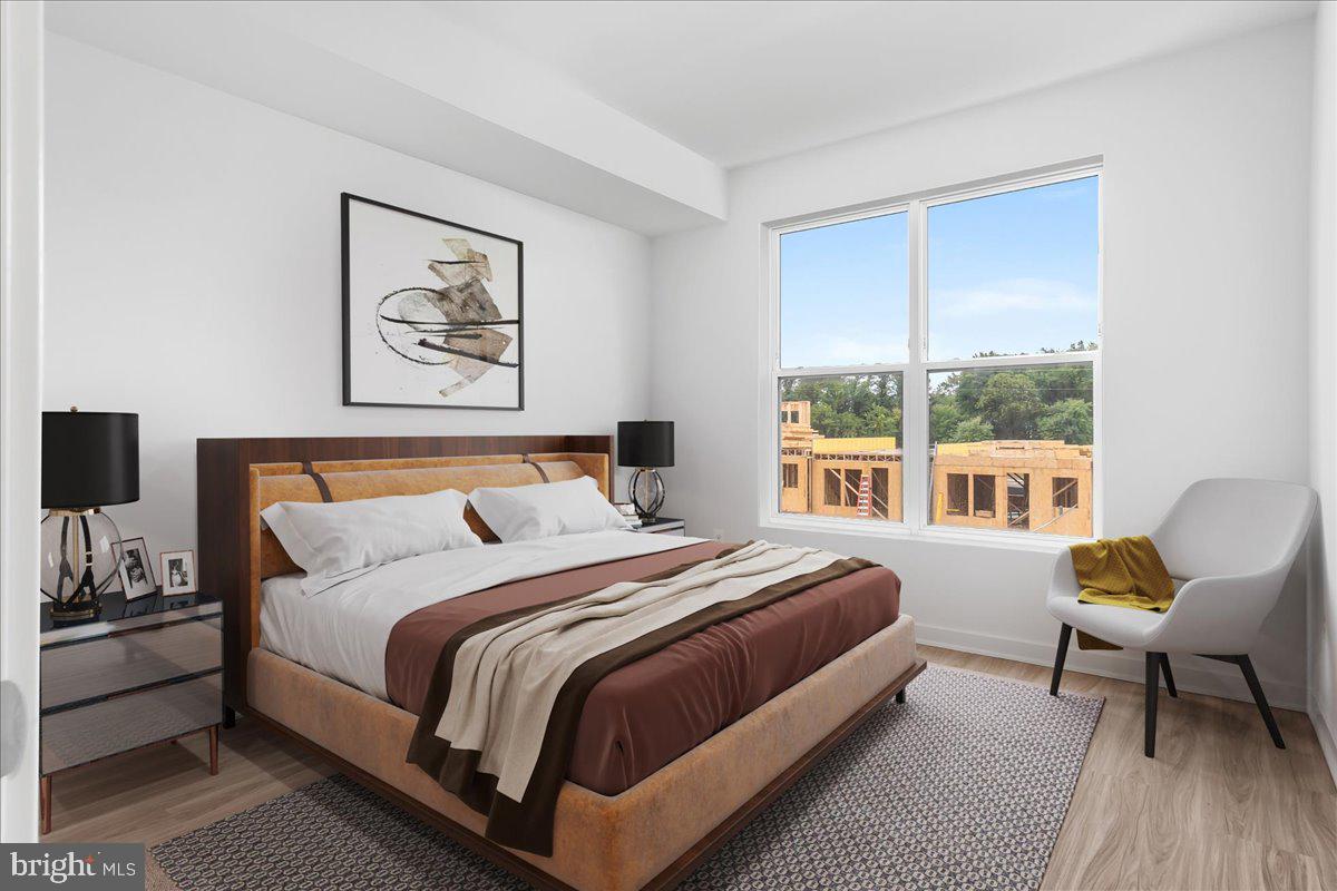 709 Iron Frg Road, Unit A Frederick, MD 21702 - Photo 15 of 15 a spacious bedroom with a bed and a large window