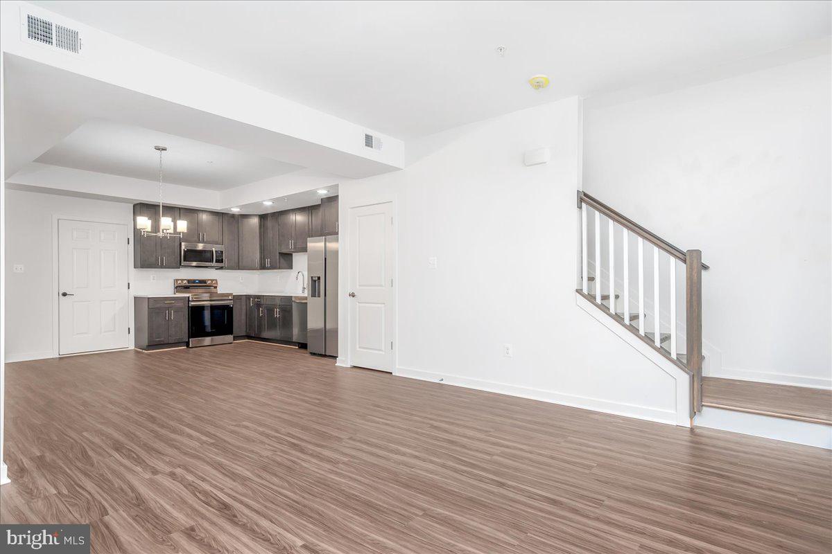 709 Iron Frg Road, Unit A Frederick, MD 21702 - Photo 8 of 15 a view of kitchen with wooden floor