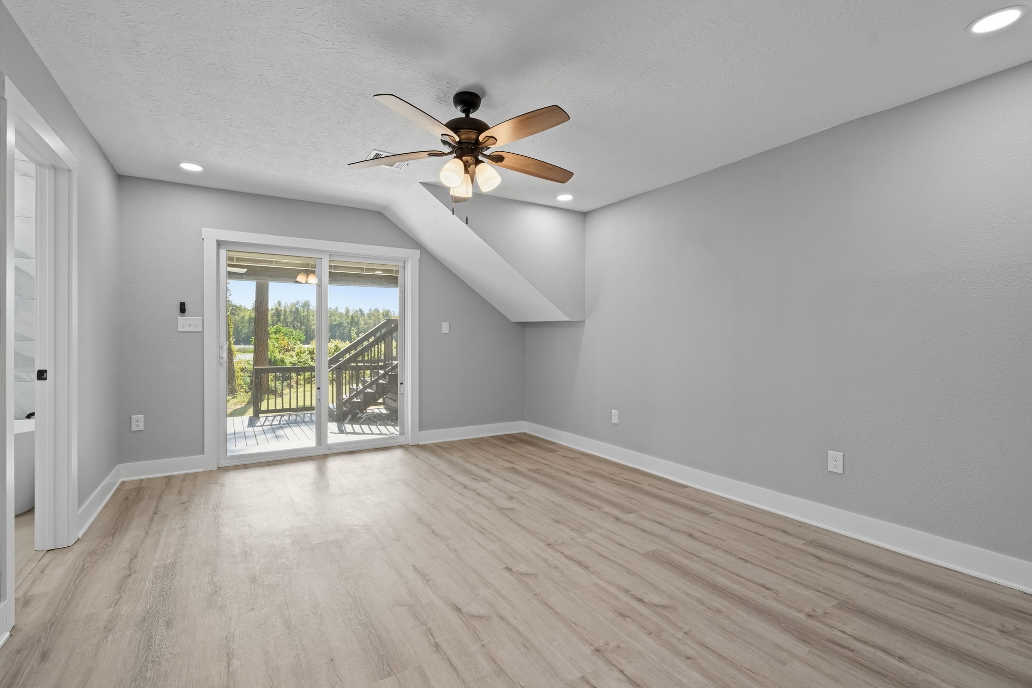 284 Hackberry Street Trinity, TX 75862 - Photo 13 of 42 wooden floor in an empty room with a window
