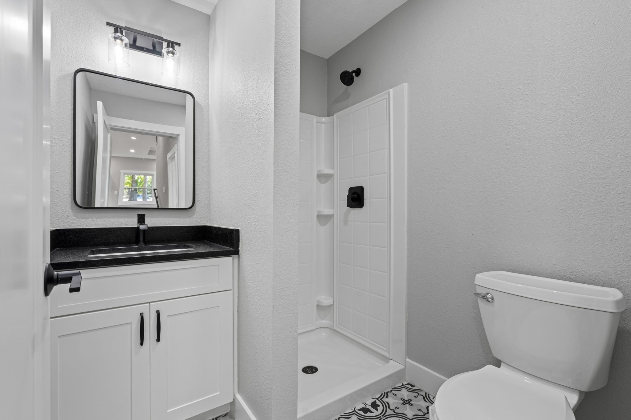 284 Hackberry Street Trinity, TX 75862 - Photo 19 of 42 a bathroom with a toilet a sink and mirror