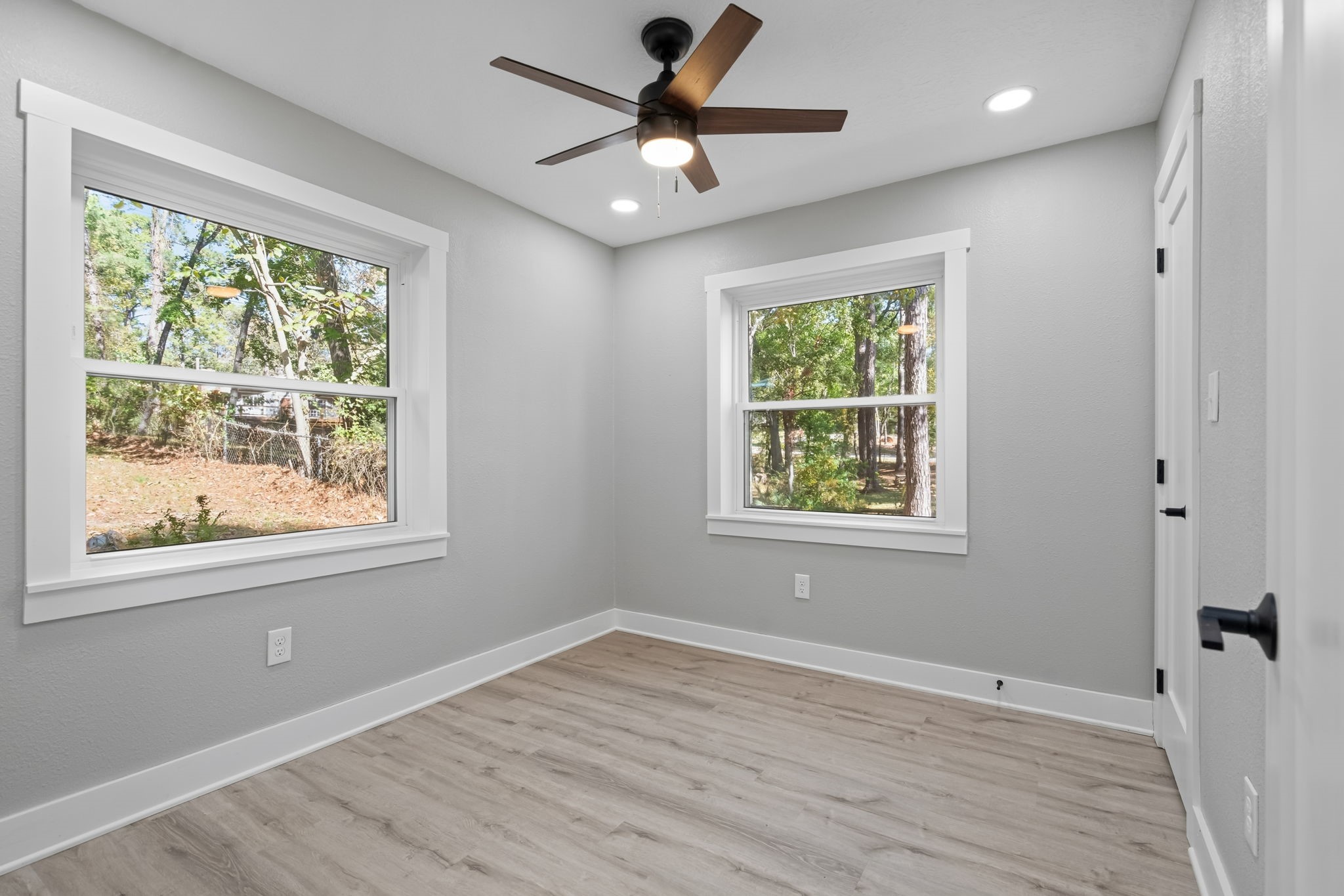 284 Hackberry Street Trinity, TX 75862 - Photo 20 of 42 a view of an empty room with wooden floor and a window