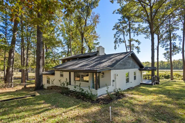 a kitchen with granite countertop a sink and cabinets