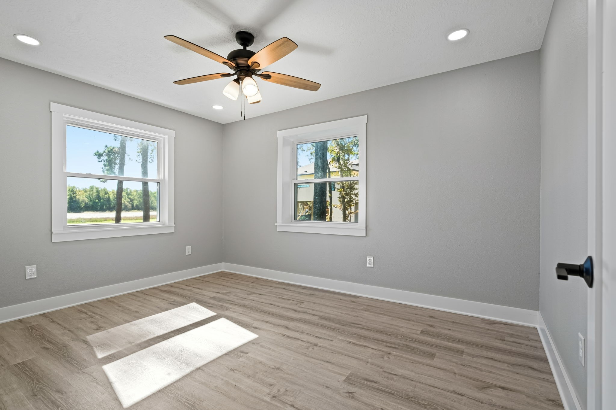 284 Hackberry Street Trinity, TX 75862 - Photo 23 of 42 wooden floor in an empty room with a window