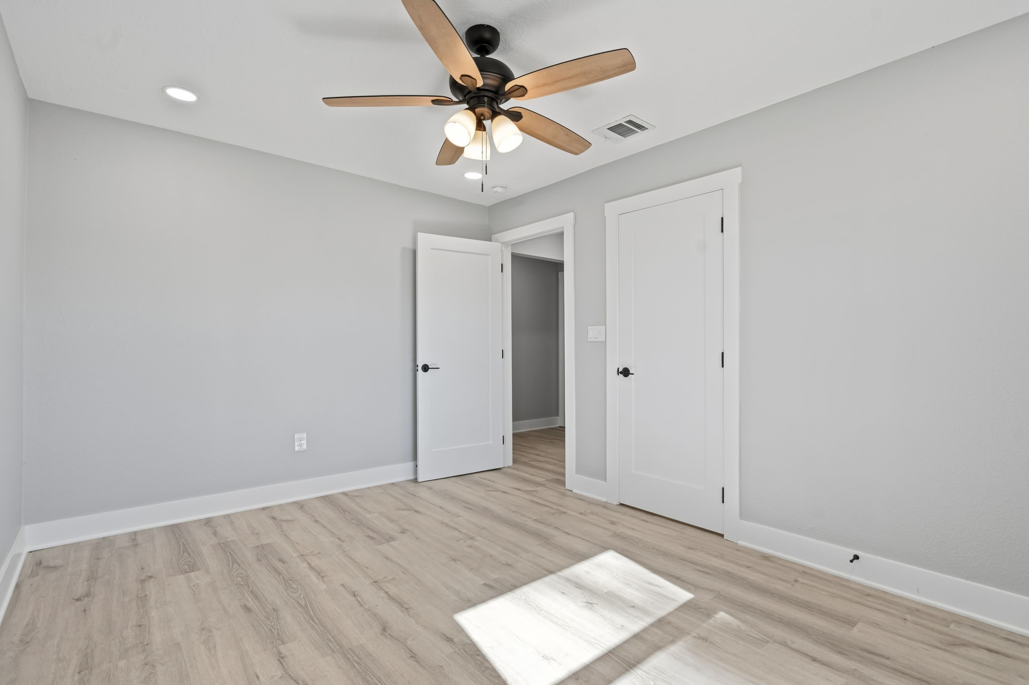 284 Hackberry Street Trinity, TX 75862 - Photo 24 of 42 wooden floor in an empty room with a window