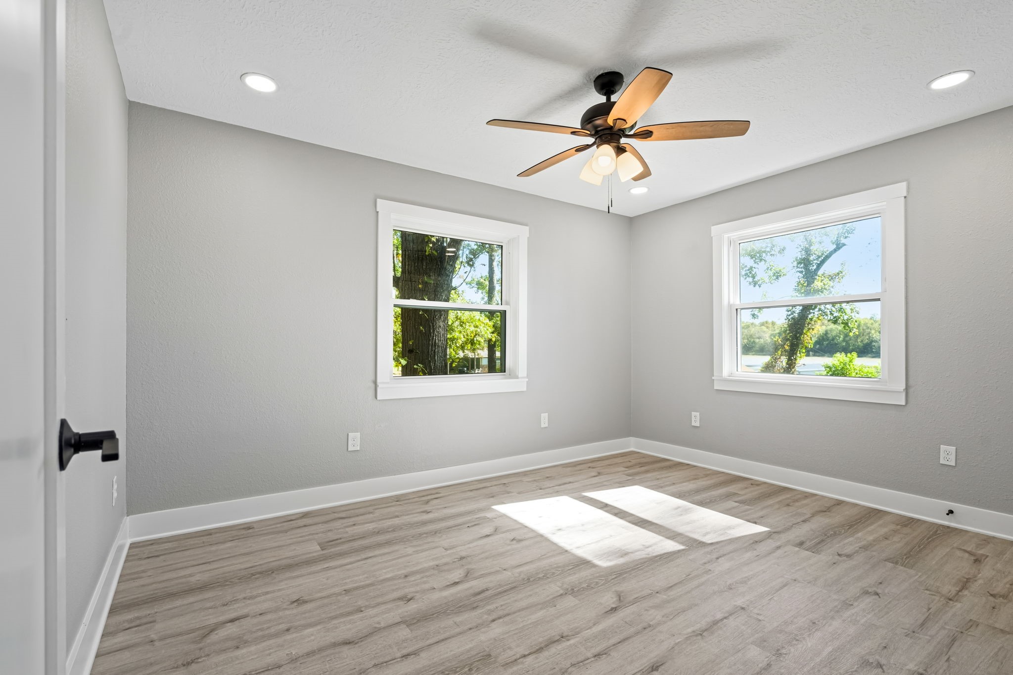 284 Hackberry Street Trinity, TX 75862 - Photo 28 of 42 wooden floor in an empty room with a window