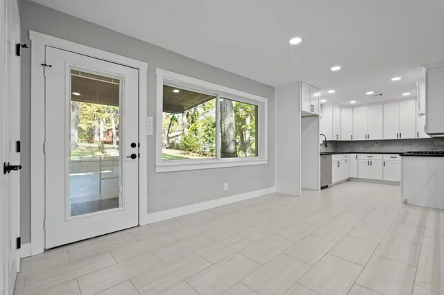 a kitchen with stainless steel appliances granite countertop a stove and a refrigerator