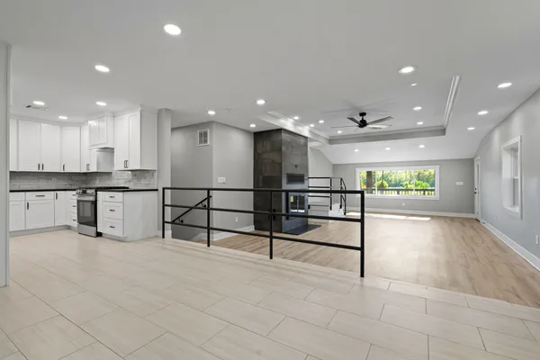 a view of kitchen with wooden floor and window