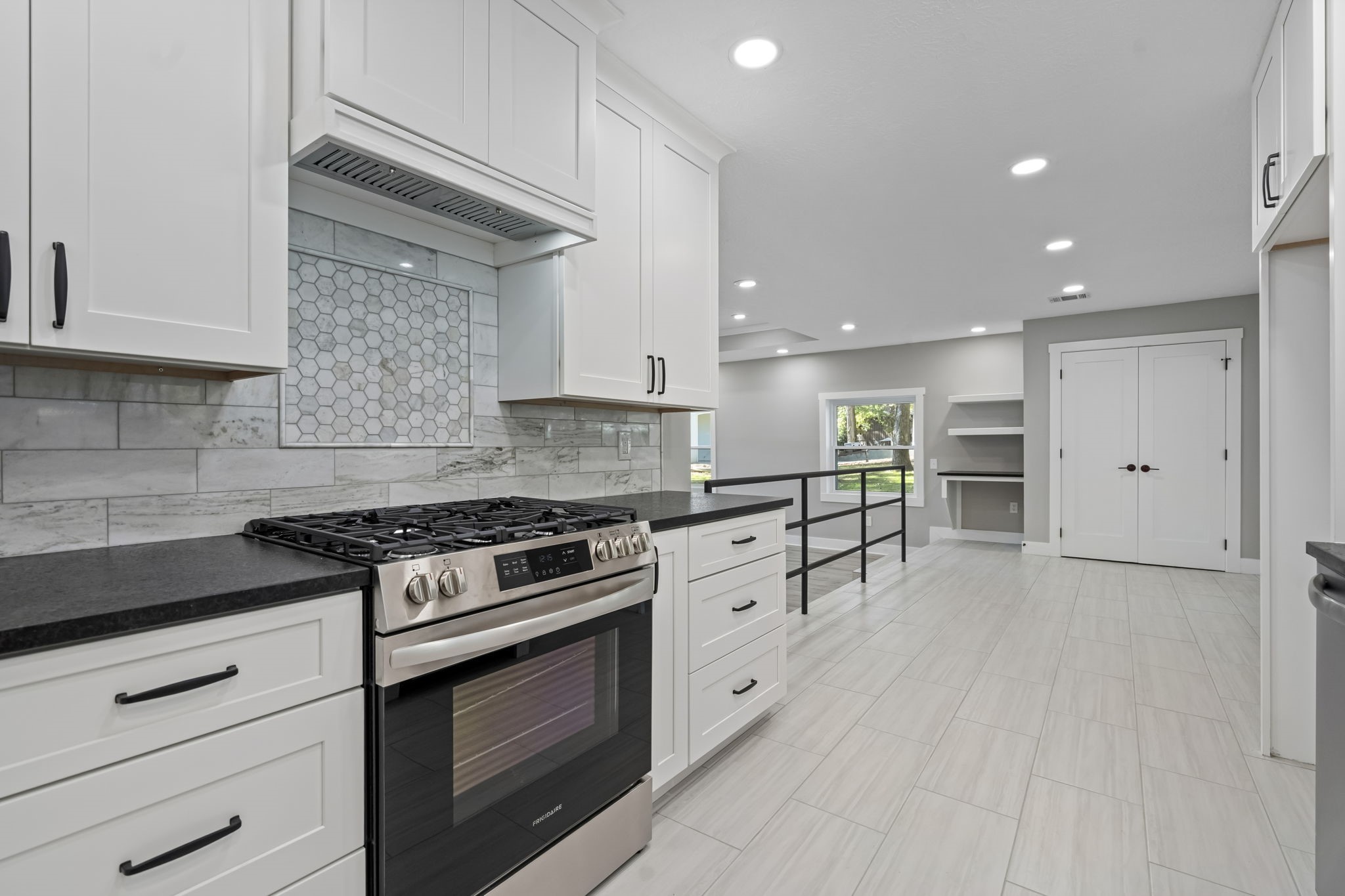 284 Hackberry Street Trinity, TX 75862 - Photo 9 of 42 a kitchen with stainless steel appliances granite countertop a stove and a refrigerator