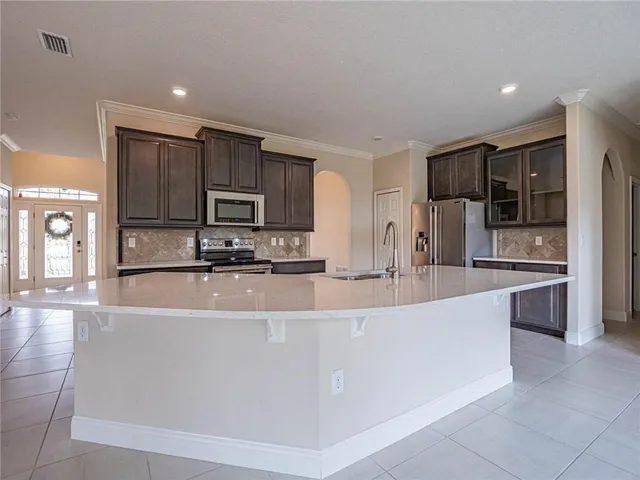 a white bath tub sitting next to a toilet