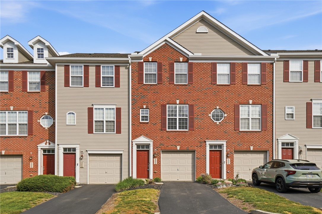 4324 Straight Arrow Road Dayton, OH 45430 - Photo 1 of 40 Three-story townhomes with garages offer convenient living.