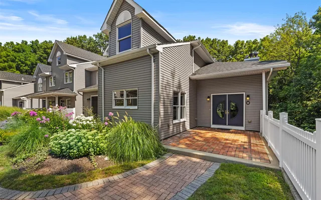 a front view of a house with garden