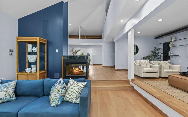 a bedroom with furniture and a fireplace