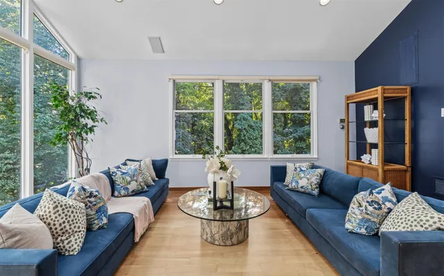 a living room with furniture and a large window