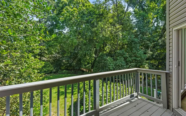 a view of balcony with wooden floor