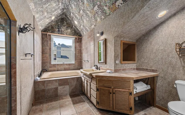 a bathroom with a sink double vanity and a bathtub
