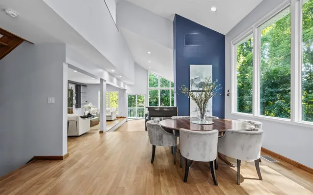 a view of a dining room with furniture window and wooden floor