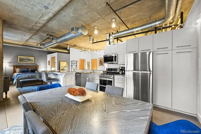 a kitchen with refrigerator and countertop