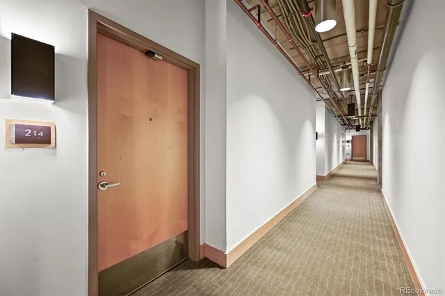 a tall building with a clock on the wall